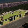 Edificio verde con tema di un mini club vicino alla spiaggia.