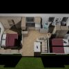 Vista dall'alto di un appartamento con due camere da letto, cucina, soggiorno e bagno.